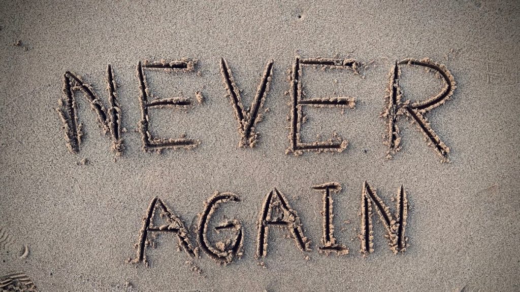 never again sand writing