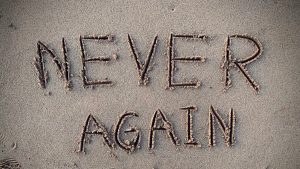 never again sand writing